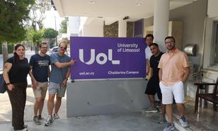 A group of students from Burgenland University of Applied Sciences in front of the University of Limassol in Cyprus